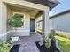 Inviting front entrance with brick walkway and well-maintained landscaping at 120 Moscata Way, Nokomis, FL 34275