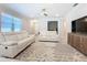 Comfortable living room showcasing a decorative rug, and a plush white sofa set at 120 Moscata Way, Nokomis, FL 34275