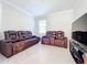 Media room featuring comfortable recliners, creating an ideal entertainment space at 120 Moscata Way, Nokomis, FL 34275