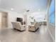 Bright living room featuring neutral tones, tile floors, and open floor plan with great natural light at 120 Moscata Way, Nokomis, FL 34275
