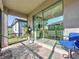 Covered patio with brick flooring and a comfortable seating area, perfect for outdoor relaxation at 120 Moscata Way, Nokomis, FL 34275