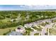 Aerial view showcasing a lovely home nestled amidst lush greenery and mature trees in a serene neighborhood at 12328 Streambed Dr, Riverview, FL 33579