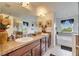 Bathroom showcasing a double vanity, soaking tub, and separate shower at 12328 Streambed Dr, Riverview, FL 33579