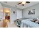 Comfortable bedroom featuring a closet, ceiling fan, and an open bathroom ensuite at 12328 Streambed Dr, Riverview, FL 33579