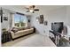 Comfortable bedroom with a large window offering natural light and a cozy seating area at 12328 Streambed Dr, Riverview, FL 33579