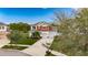 Charming two-story home featuring a three-car garage, well-manicured lawn, and inviting curb appeal at 12328 Streambed Dr, Riverview, FL 33579
