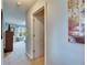 Hallway view leading to a bedroom, showcasing the home's layout and design at 12328 Streambed Dr, Riverview, FL 33579
