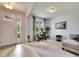 Bright home office with large window, neutral carpet, and comfortable seating area at 12328 Streambed Dr, Riverview, FL 33579