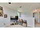 Upstairs loft area provides extra space for entertainment, complete with a tv and ample seating at 12328 Streambed Dr, Riverview, FL 33579
