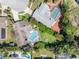 Aerial view of neighborhood featuring properties with pools, landscaped yards, and cul-de-sac location at 13420 Rustic Pines S Blvd, Seminole, FL 33776