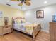 Cozy bedroom showcases bamboo flooring, bright walls, and ample natural light at 13420 Rustic Pines S Blvd, Seminole, FL 33776