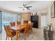 Cozy dining room features stylish accents, stone fireplace and access to the pool at 13420 Rustic Pines S Blvd, Seminole, FL 33776