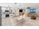 Modern kitchen with a large island, granite countertops, stainless steel appliances, and an open floor plan at 13420 Rustic Pines S Blvd, Seminole, FL 33776