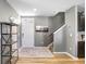 Inviting foyer with wood floors and staircase at 16316 Silent Sands Ln, Odessa, FL 33556