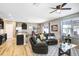 Open living area connects kitchen, dining, & living space, featuring modern appliances & comfortable seating, perfect for gatherings at 16316 Silent Sands Ln, Odessa, FL 33556