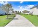 A scenic walking path surrounded by lush landscaping, providing a peaceful community amenity at 16316 Silent Sands Ln, Odessa, FL 33556