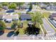 Aerial view highlights the landscaped yard with a gazebo, a shed and a fire pit at 1766 10Th Sw St, Largo, FL 33778