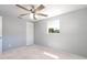 Bedroom featuring carpet, closet, ceiling fan, neutral paint, and a window at 1766 10Th Sw St, Largo, FL 33778