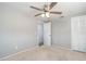 Bedroom with carpet, neutral paint, closet, and bathroom access at 1766 10Th Sw St, Largo, FL 33778