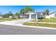 Well-kept single-Gathering home featuring a one-car garage, manicured lawn, and a welcoming front yard at 1766 10Th Sw St, Largo, FL 33778