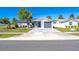 A cozy single-Gathering home with a tidy front lawn and an attached one-car garage and well maintained lawn at 1766 10Th Sw St, Largo, FL 33778
