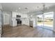 Remodeled kitchen features white cabinets, new stainless appliances, and a sliding glass door to the back yard at 1766 10Th Sw St, Largo, FL 33778