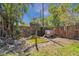 Backyard pond with a small wooden house and lush foliage, creating a peaceful retreat at 1988 58Th N St, St Petersburg, FL 33710