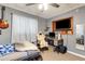 Cozy bedroom with a window, desk, and guitar, perfect for relaxing and pursuing hobbies at 1988 58Th N St, St Petersburg, FL 33710