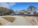 Well-maintained home with ample driveway space and a manicured lawn, offering comfortable living at 1988 58Th N St, St Petersburg, FL 33710