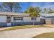 Charming home with a brick exterior, a spacious driveway, and a well-maintained yard at 1988 58Th N St, St Petersburg, FL 33710