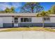 Charming home with a brick exterior, a well-maintained yard, and mature trees in a desirable neighborhood at 1988 58Th N St, St Petersburg, FL 33710