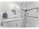 Clean, remodeled bathroom with tiled shower, modern vanity, and brushed fixtures at 202 New Hope Rd, Brandon, FL 33510