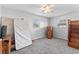 Bright bedroom with two windows, gray carpeting, and ready for your personal touches at 202 New Hope Rd, Brandon, FL 33510