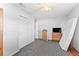 Neutral bedroom featuring gray carpeting, closet, ceiling fan, and a light paint at 202 New Hope Rd, Brandon, FL 33510