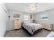 Comfortable bedroom with gray carpeting, ceiling fan, and good natural lighting at 202 New Hope Rd, Brandon, FL 33510