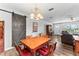 Dining room with a sliding barn door and chandelier lighting at 202 New Hope Rd, Brandon, FL 33510