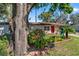 Cozy home with an inviting front yard and colorful landscaping, perfect for curb appeal at 202 New Hope Rd, Brandon, FL 33510