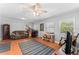 Comfortable living room with a ceiling fan and wood flooring at 202 New Hope Rd, Brandon, FL 33510