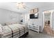 Main bedroom featuring ceiling fan, access to ensuite bath, and great natural light at 202 New Hope Rd, Brandon, FL 33510