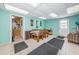 Multi-purpose common room featuring tables and chairs with a small kitchenette at 2571 Cyprus Dr # 1-105, Palm Harbor, FL 34684