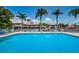 Lake Tarpon Villas features a large pool with ample seating and views of the villas at 2571 Cyprus Dr # 1-105, Palm Harbor, FL 34684