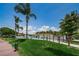 Well-maintained community pool area at Lake Tarpon Villas, surrounded by lush greenery at 2571 Cyprus Dr # 1-105, Palm Harbor, FL 34684