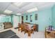 Bright dining room features tile flooring, large table, and light-blue painted walls at 2571 Cyprus Dr # 1-105, Palm Harbor, FL 34684