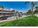 Scenic waterfront featuring private boat docks, serene water views, and lush green landscaping at 2571 Cyprus Dr # 1-105, Palm Harbor, FL 34684
