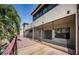 Exterior view of a screened in porch area with view of the community deck at 2571 Cyprus Dr # 1-105, Palm Harbor, FL 34684