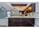 Modern kitchen with stainless steel appliances, white countertop island, and unique light fixtures at 2571 Cyprus Dr # 1-105, Palm Harbor, FL 34684