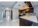Modern kitchen featuring stainless steel appliances, dark cabinetry, and a bright white countertop at 2571 Cyprus Dr # 1-105, Palm Harbor, FL 34684