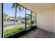 Enclosed porch with neutral walls and large windows at 2571 Cyprus Dr # 1-105, Palm Harbor, FL 34684