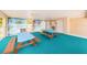 A covered recreational space with picnic tables offers an inviting place for community gatherings at 2571 Cyprus Dr # 1-105, Palm Harbor, FL 34684