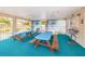 A covered recreational space with picnic tables offers an inviting place for community gatherings at 2571 Cyprus Dr # 1-105, Palm Harbor, FL 34684